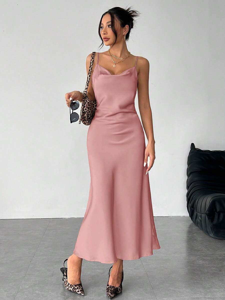 Women's long apricot satin cami dress featuring a draped swing collar, spaghetti straps, backless zipper back, and mermaid hem.