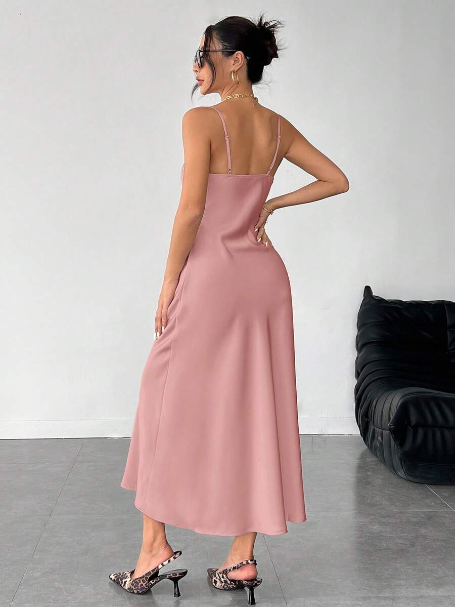 Women's long apricot satin cami dress featuring a draped swing collar, spaghetti straps, backless zipper back, and mermaid hem.