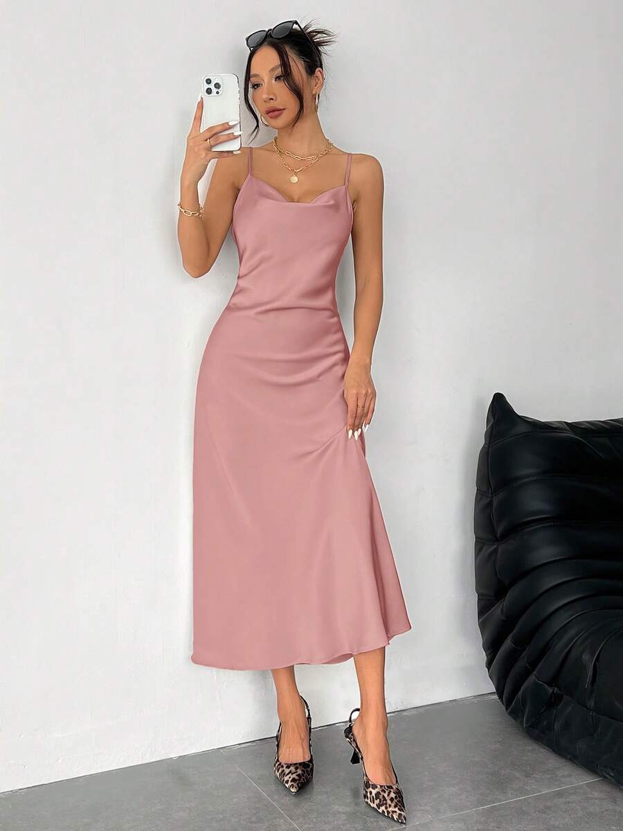 Women's long apricot satin cami dress featuring a draped swing collar, spaghetti straps, backless zipper back, and mermaid hem.