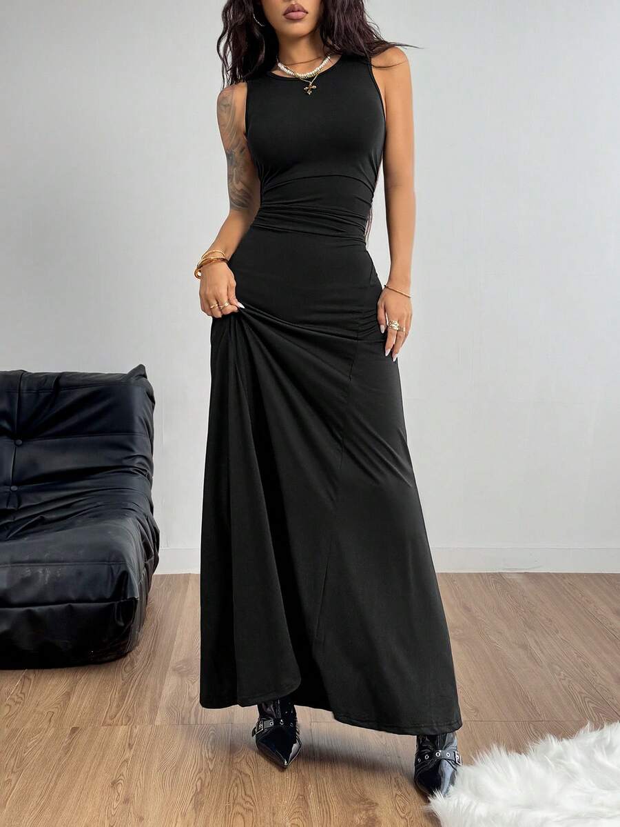 Sleeveless black ruched maxi dress for women featuring a round neck, backless zipper closure, slim fit silhouette, and mermaid hemline.