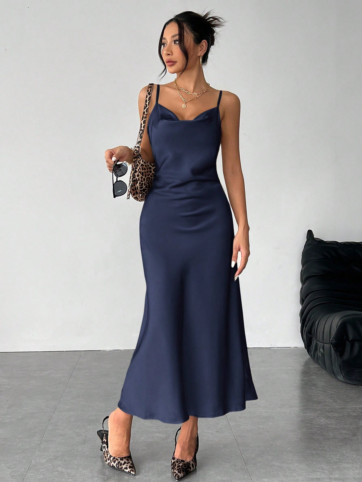 Women's long apricot satin cami dress featuring a draped swing collar, spaghetti straps, backless zipper back, and mermaid hem.