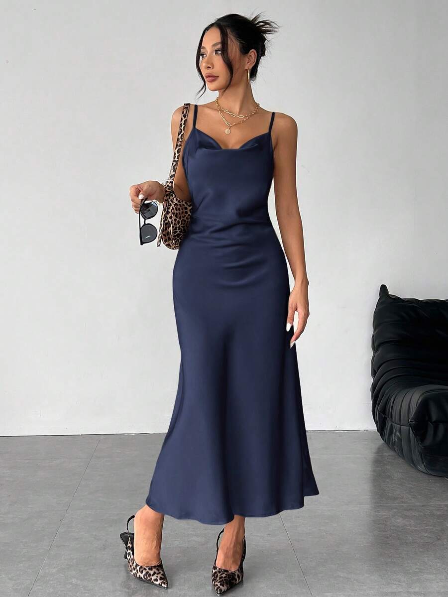 Women's long apricot satin cami dress featuring a draped swing collar, spaghetti straps, backless zipper back, and mermaid hem.