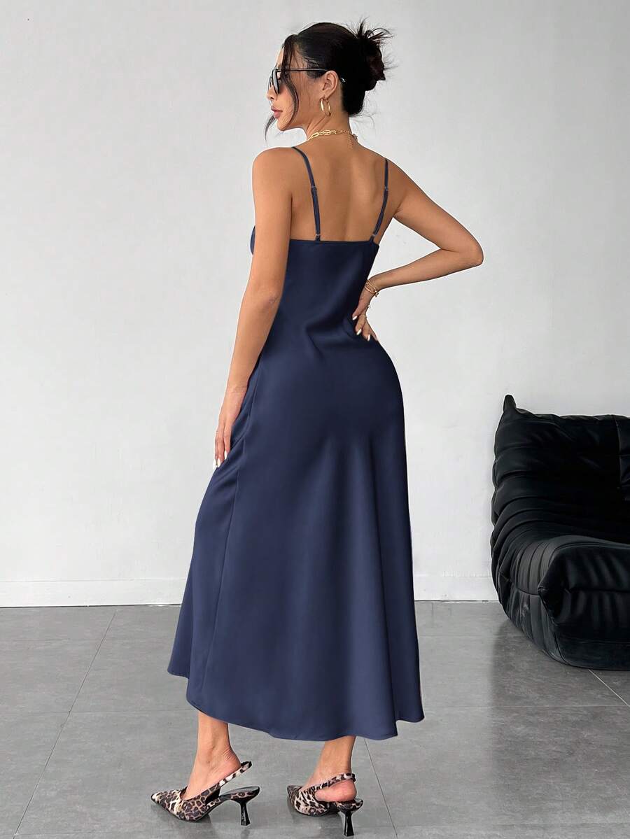 Women's long apricot satin cami dress featuring a draped swing collar, spaghetti straps, backless zipper back, and mermaid hem.
