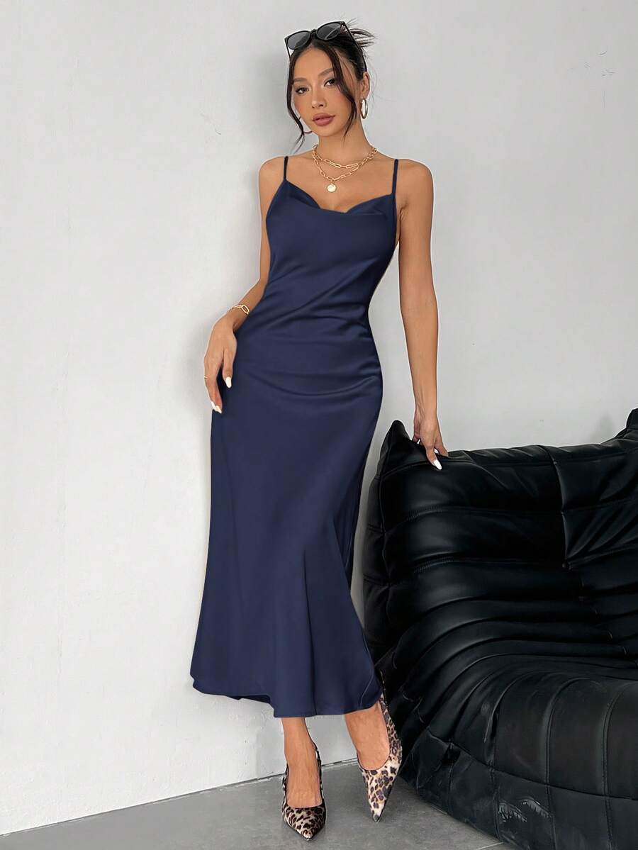 Women's long apricot satin cami dress featuring a draped swing collar, spaghetti straps, backless zipper back, and mermaid hem.