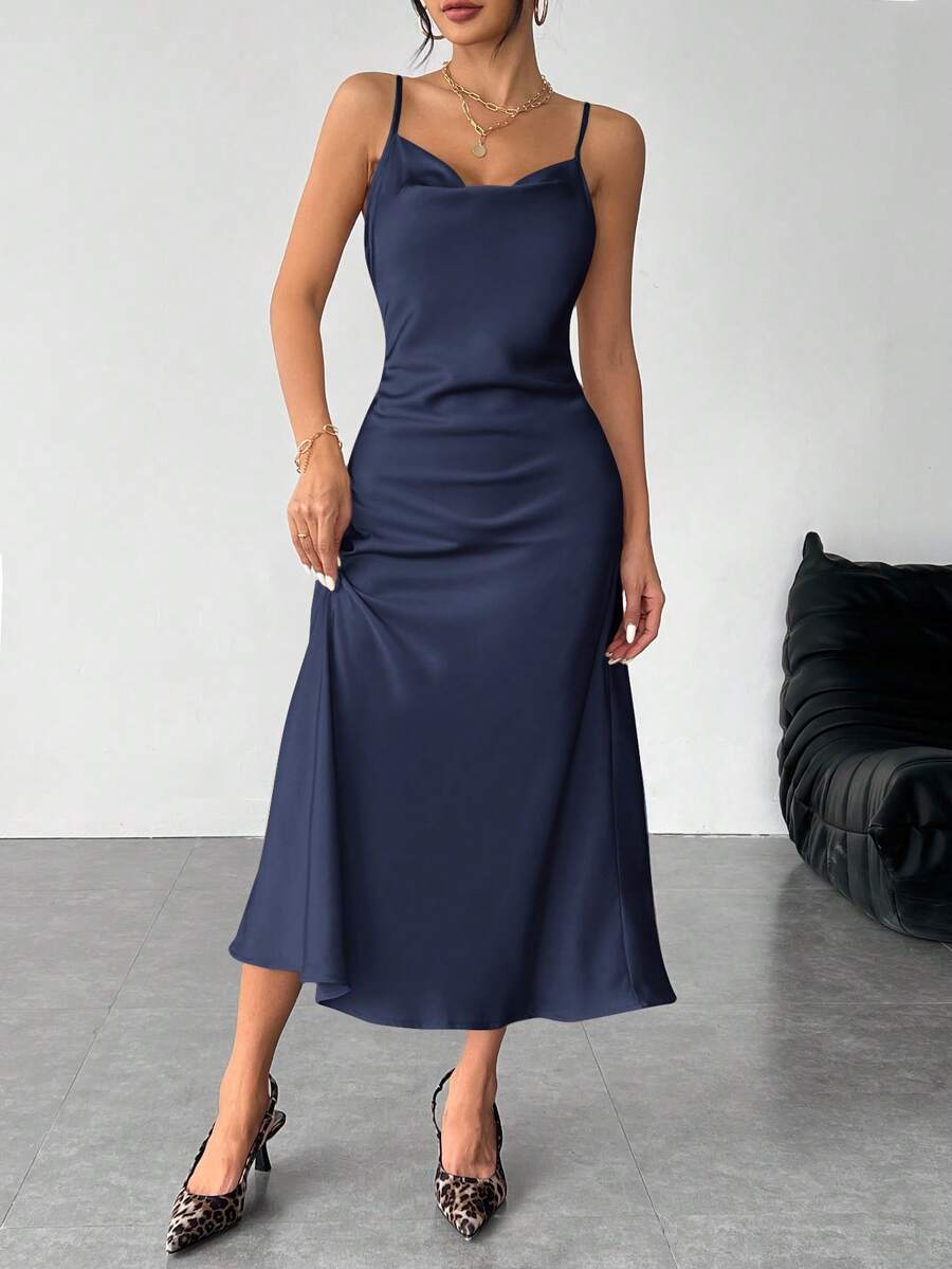 Women's long apricot satin cami dress featuring a draped swing collar, spaghetti straps, backless zipper back, and mermaid hem.