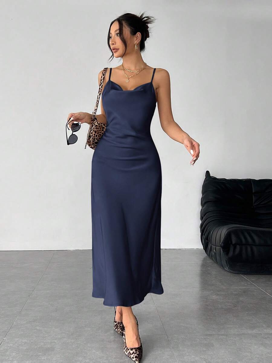 Women's long apricot satin cami dress featuring a draped swing collar, spaghetti straps, backless zipper back, and mermaid hem.