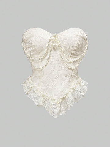 Apricot strapless asymmetrical blouse for women featuring a backless design and ruffle hem.