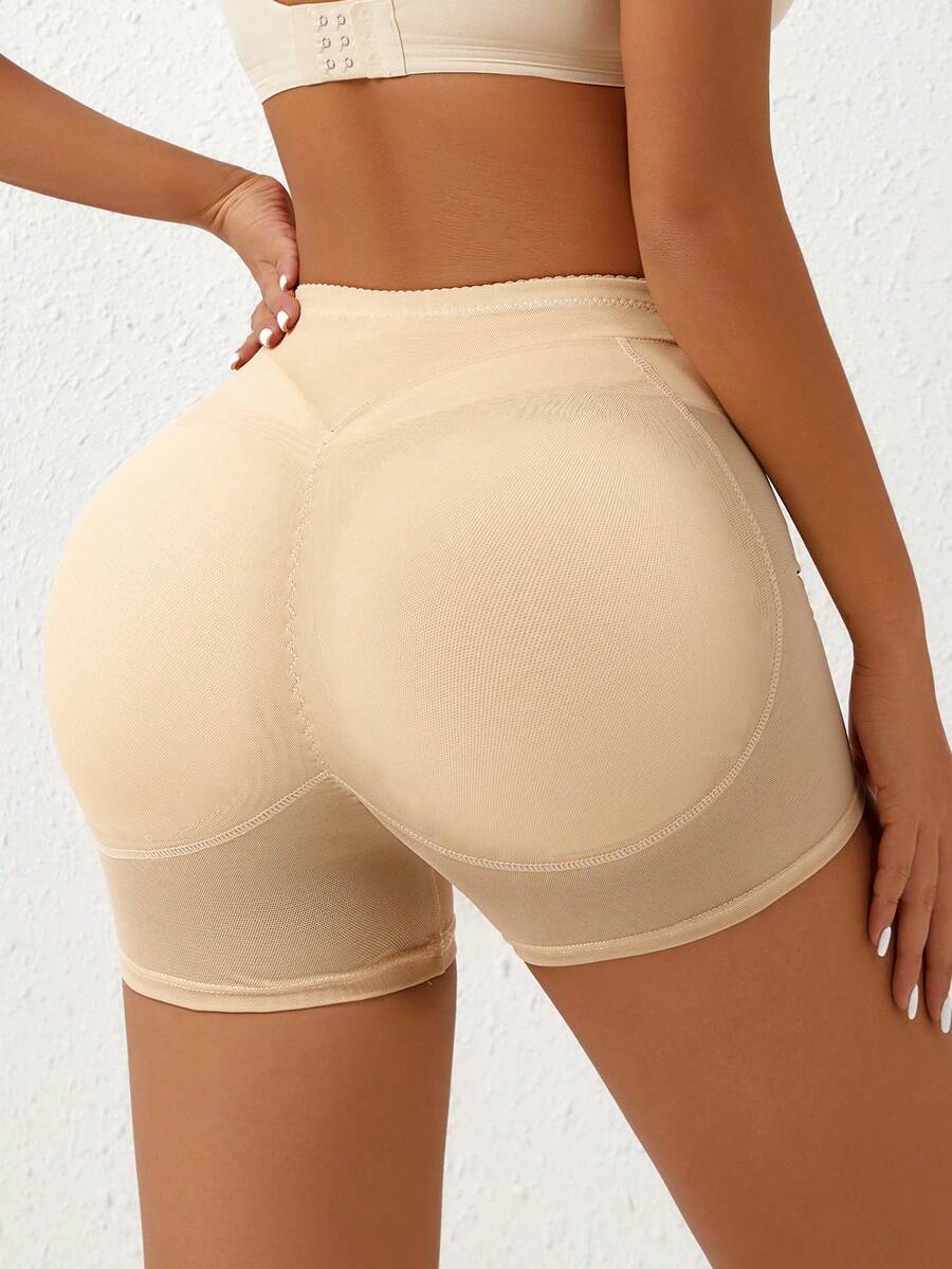 Apricot high-waist seamless butt lifting shapewear shorts with removable foam padding for women.