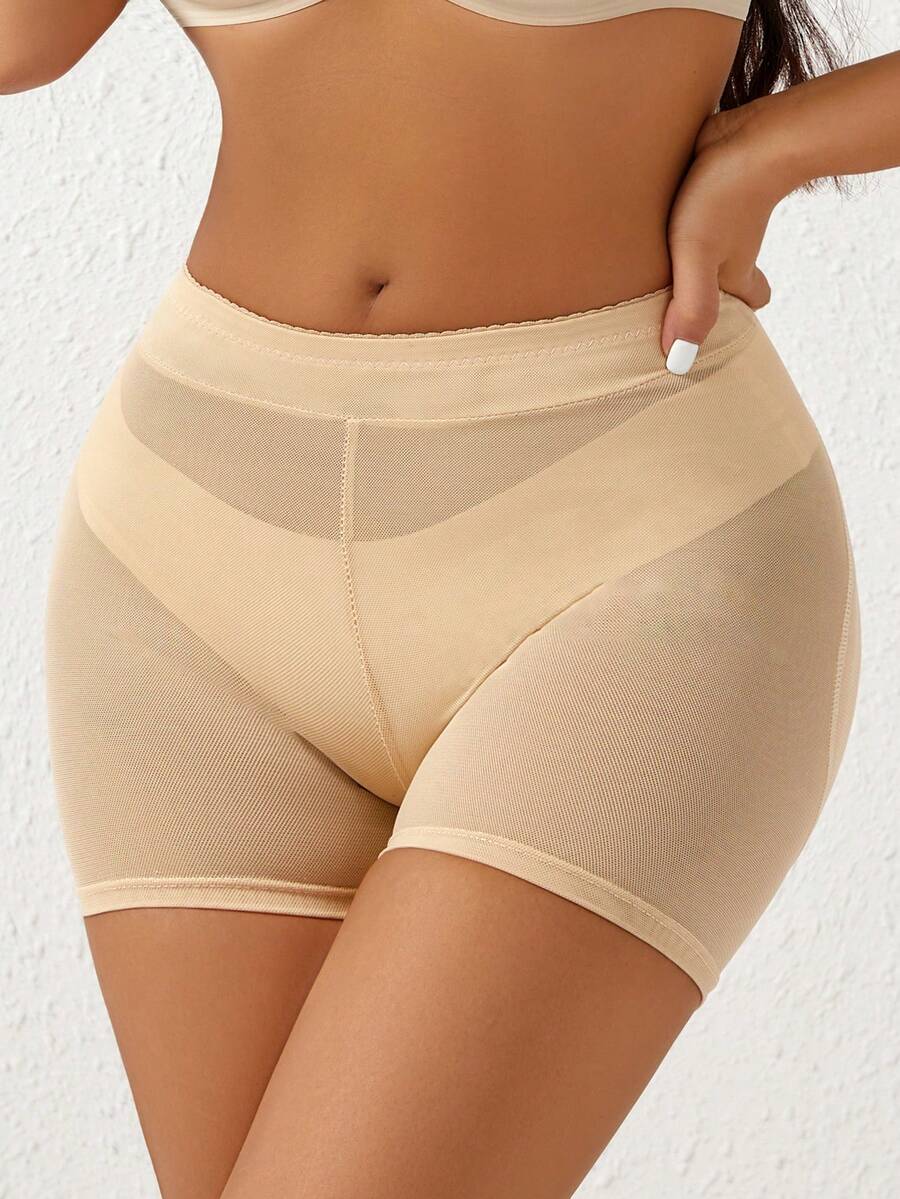 Apricot high-waist seamless butt lifting shapewear shorts with removable foam padding for women.