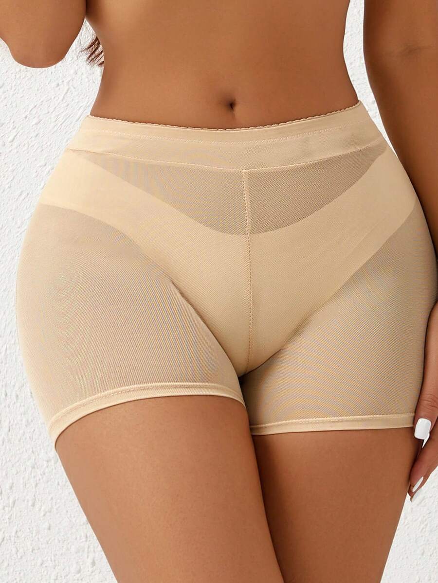 Apricot high-waist seamless butt lifting shapewear shorts with removable foam padding for women.