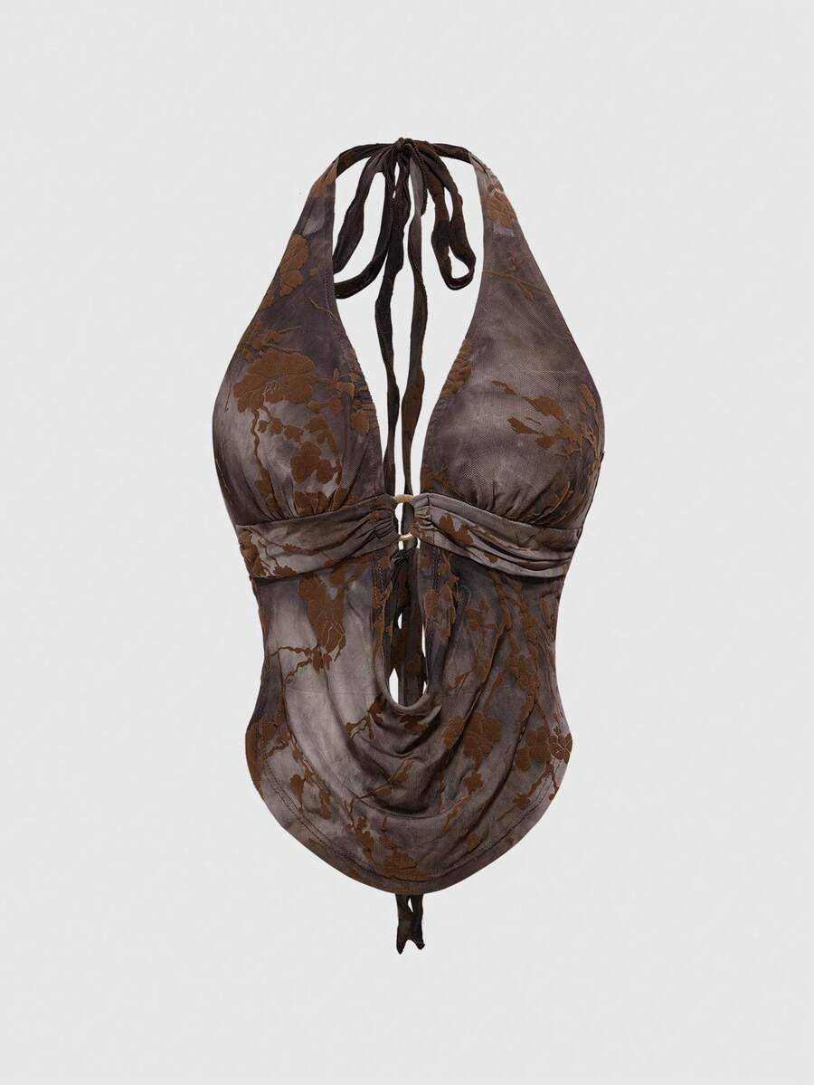 Brown tie dye halter crop top for women featuring a backless design, asymmetrical hem with ring detail, and flocked floral print.