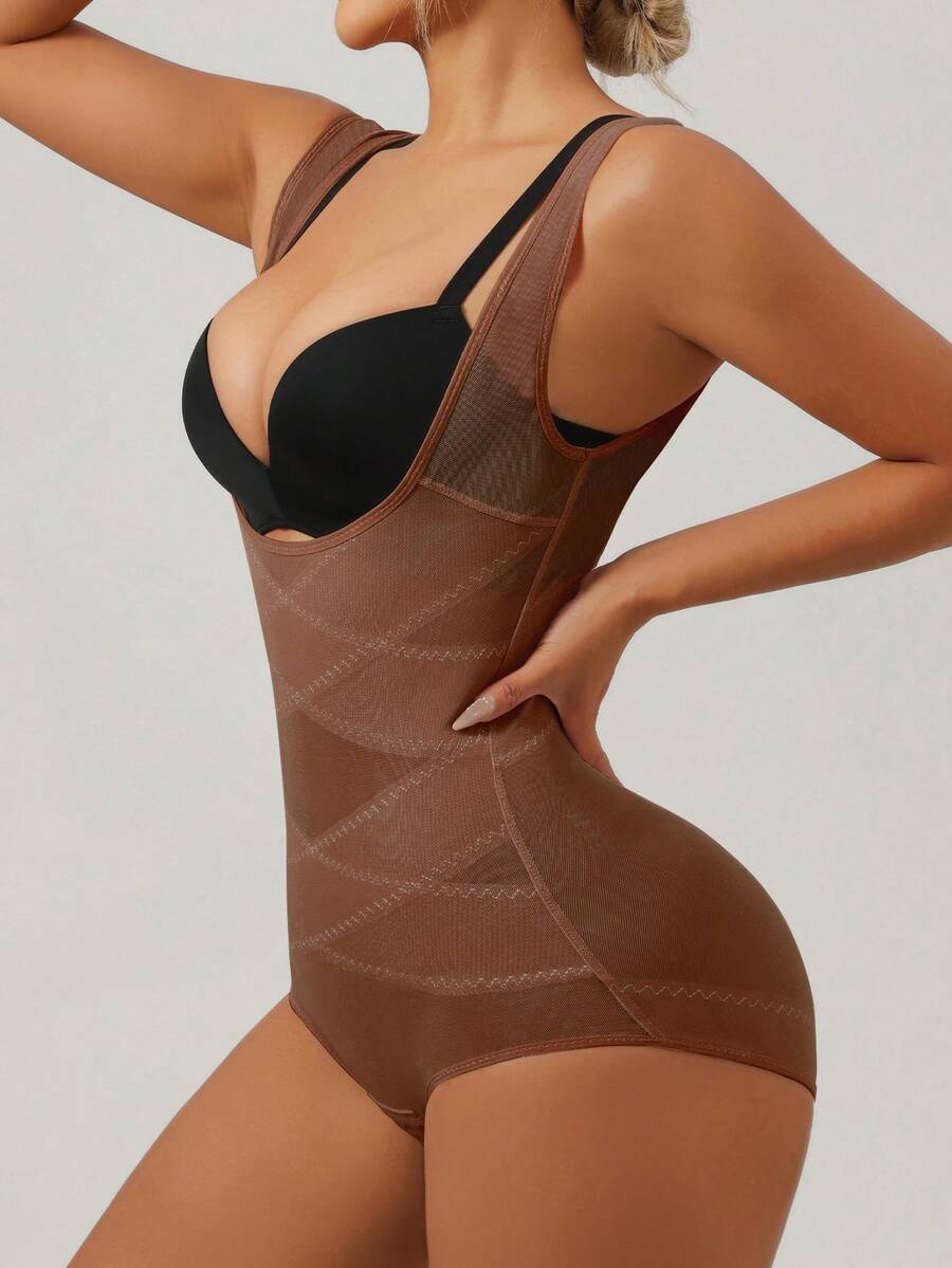 Apricot semi-sheer mesh shapewear bodysuit for women featuring a low-cut neckline, bust support, contrast mesh details, and Bermuda shorts length.