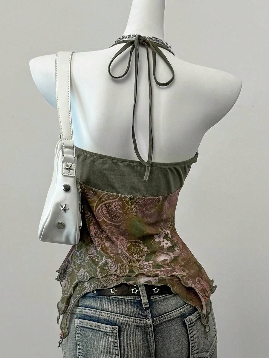 Women's backless halter cami top featuring a paisley print, sleeveless design, and an asymmetrical hem in knitted fabric.