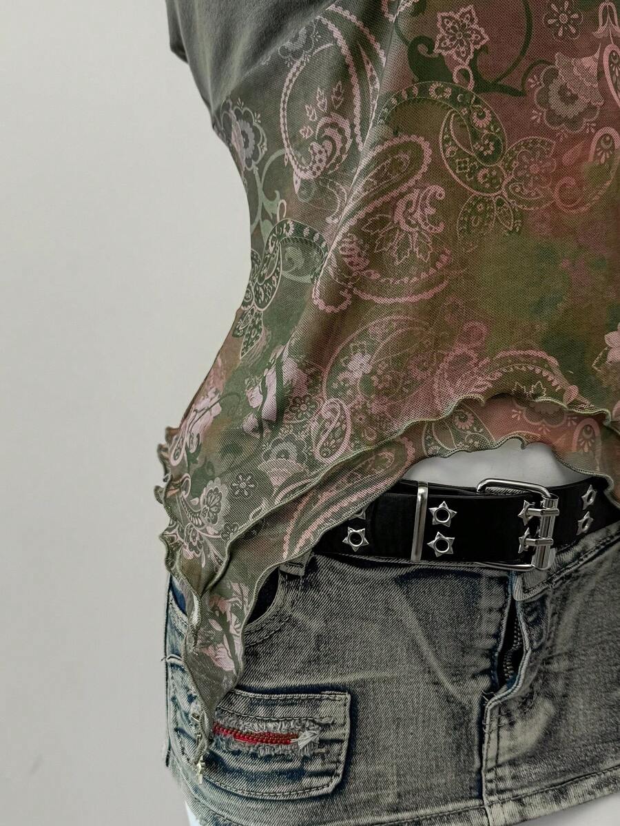 Women's backless halter cami top featuring a paisley print, sleeveless design, and an asymmetrical hem in knitted fabric.