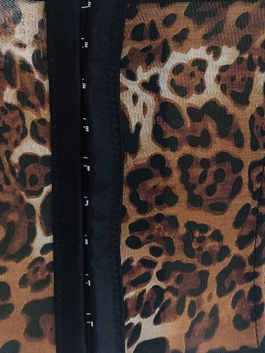 Black lace bustier corset top for women with asymmetrical contrast lace, lace-up detail, sleeveless crop cut, and light support.