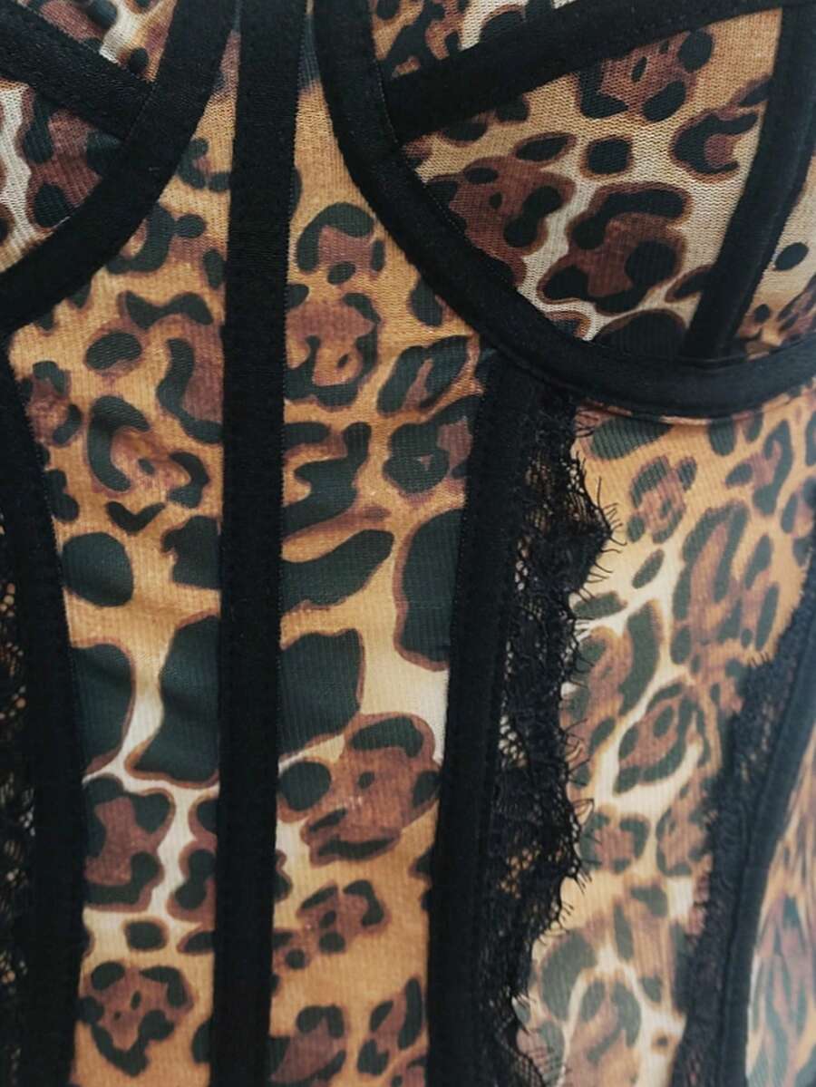 Black lace bustier corset top for women with asymmetrical contrast lace, lace-up detail, sleeveless crop cut, and light support.