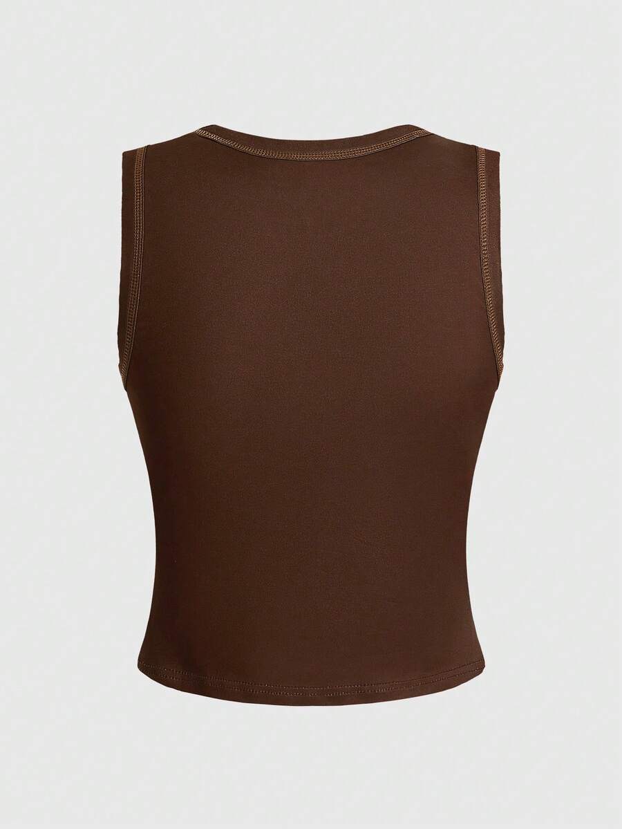 Burgundy women's crop tank top featuring contrast binding trim, graphic letter print, and a slim fit round neck silhouette.
