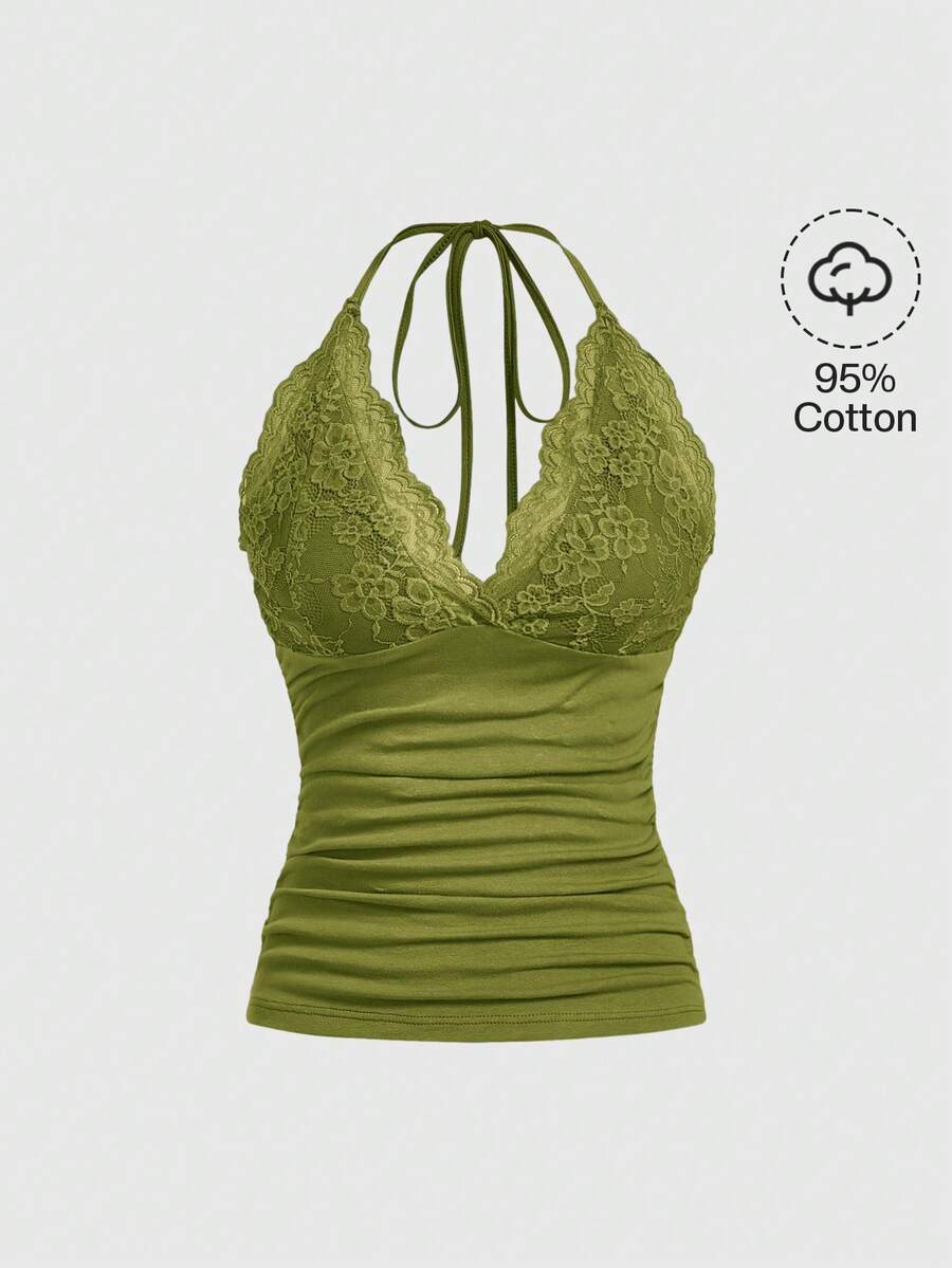 A women's black backless halter top featuring contrast lace trim, ruched front detail, and slim fit soft knitted fabric.
