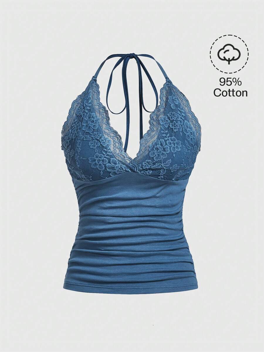 A women's black backless halter top featuring contrast lace trim, ruched front detail, and slim fit soft knitted fabric.