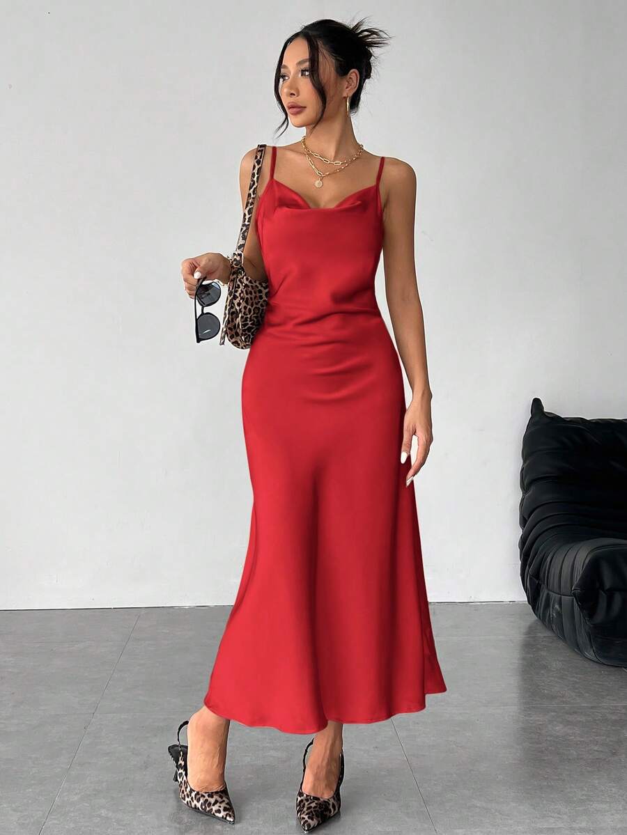Women's long apricot satin cami dress featuring a draped swing collar, spaghetti straps, backless zipper back, and mermaid hem.