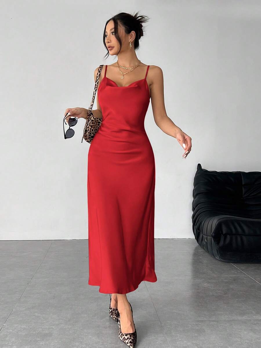Women's long apricot satin cami dress featuring a draped swing collar, spaghetti straps, backless zipper back, and mermaid hem.
