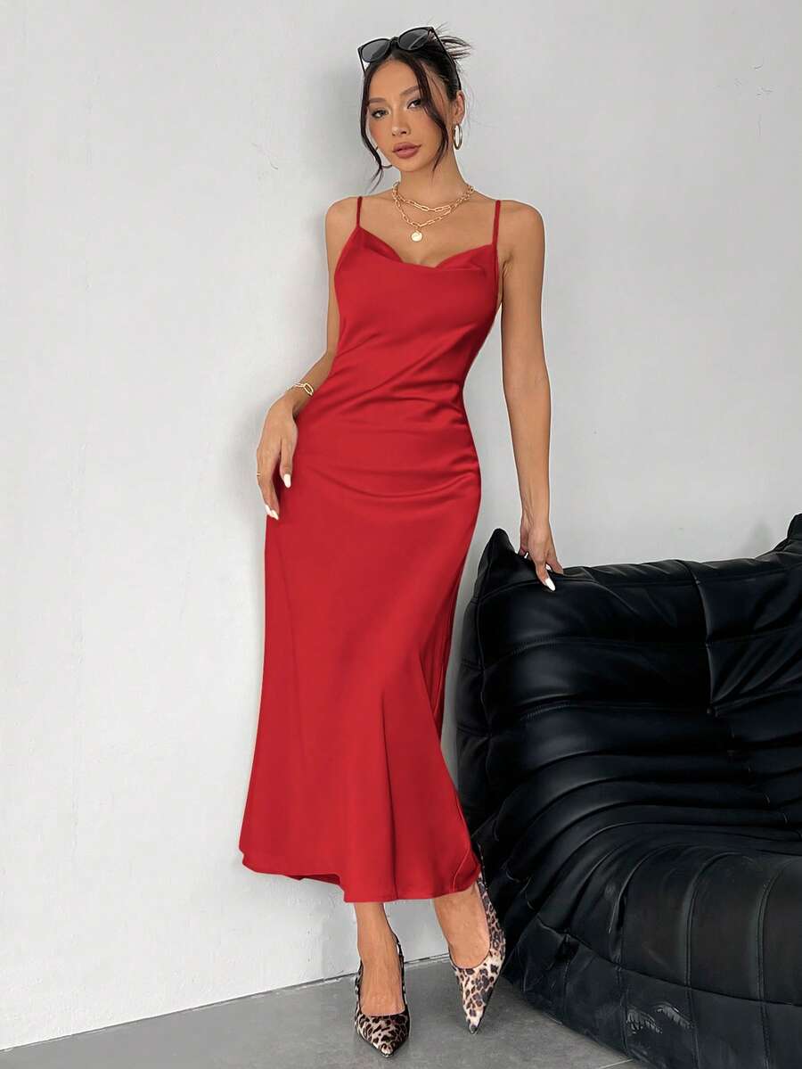 Women's long apricot satin cami dress featuring a draped swing collar, spaghetti straps, backless zipper back, and mermaid hem.
