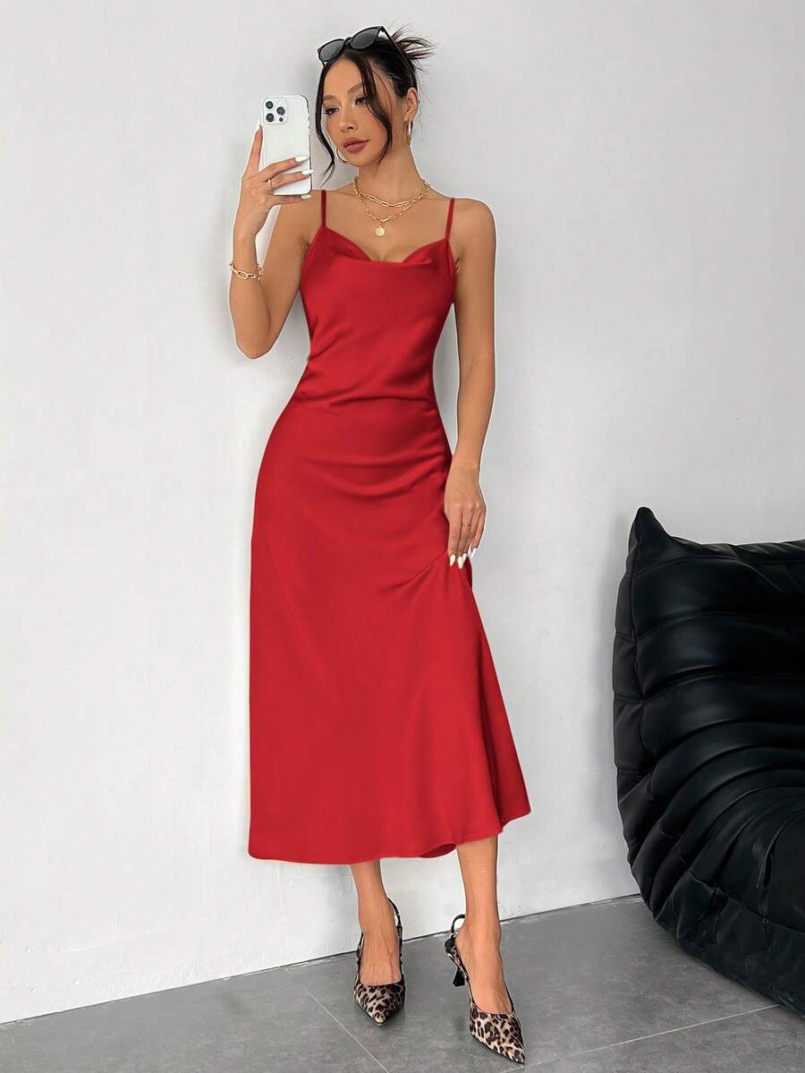Women's long apricot satin cami dress featuring a draped swing collar, spaghetti straps, backless zipper back, and mermaid hem.