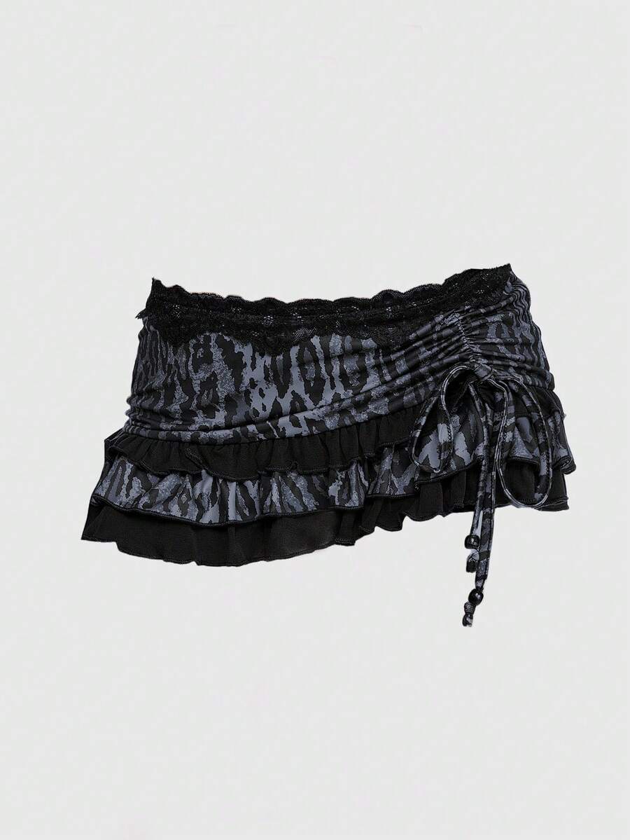 Black ultra low waist ruched ruffle mini skirt for women with drawstring details and high stretch knitted fabric.