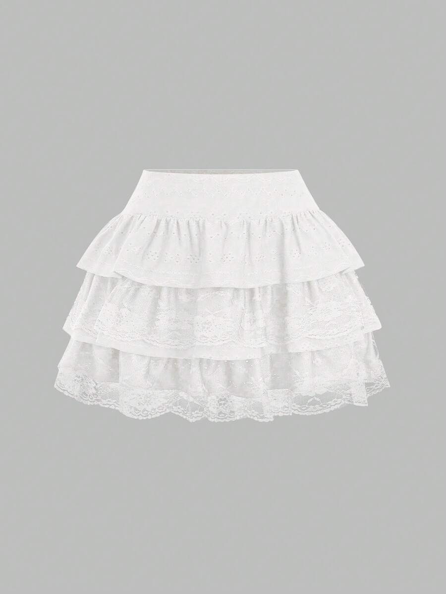 White Y2K layered ruffle mini skirt with contrast lace trim, low waist, and tiered hem.