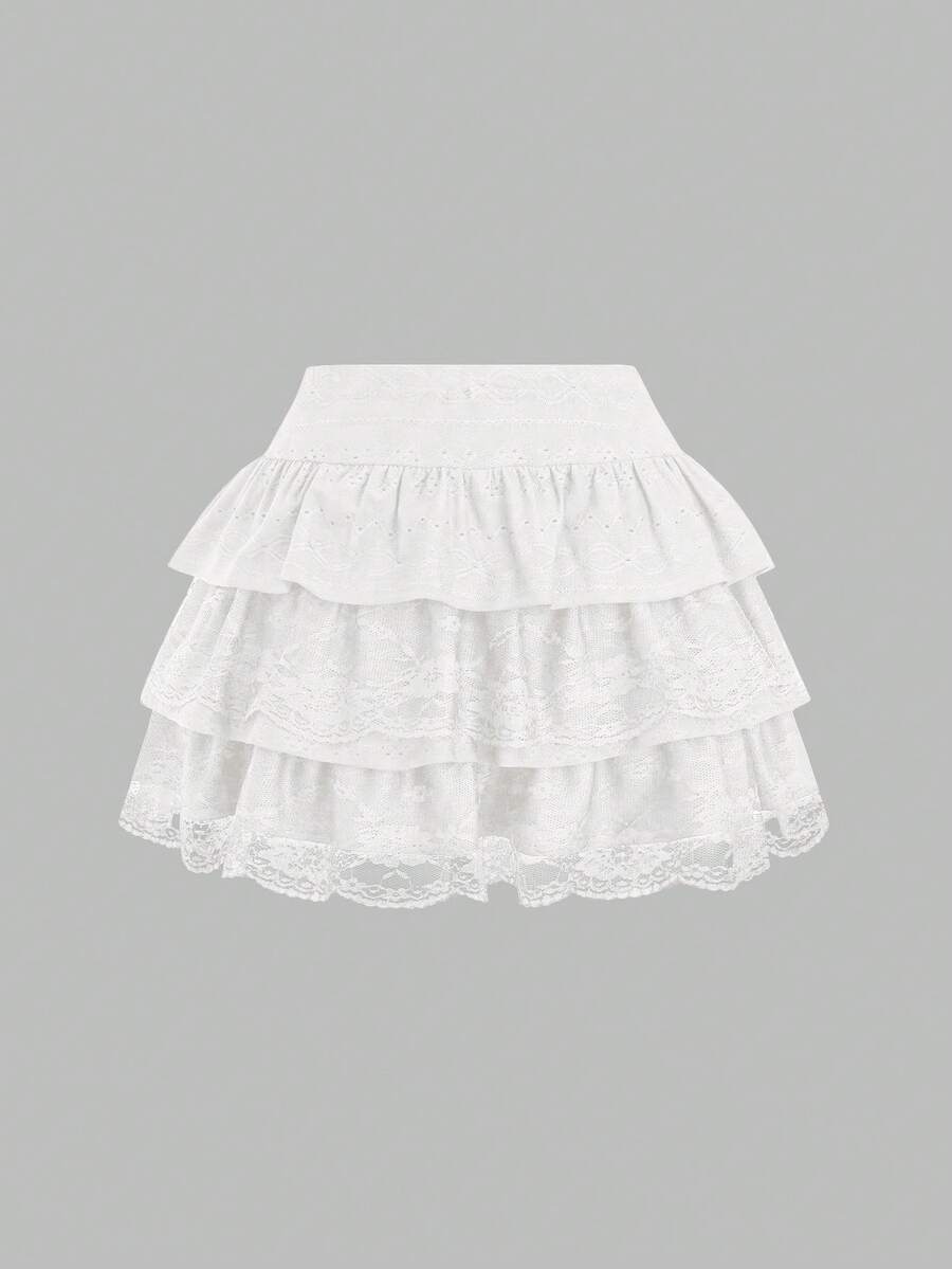 White Y2K layered ruffle mini skirt with contrast lace trim, low waist, and tiered hem.