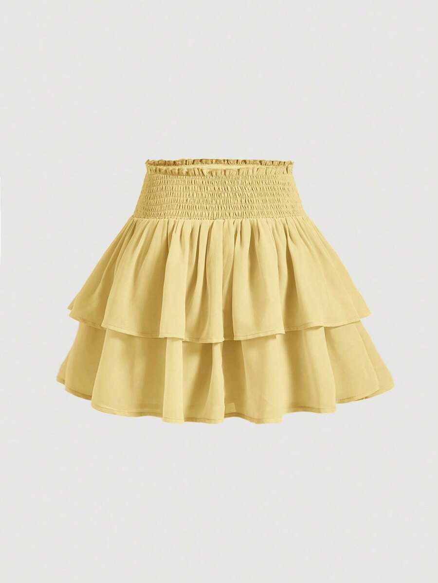 Women's high waist tiered ruffle layered mini skort in black featuring shirred details and ruffle hem.