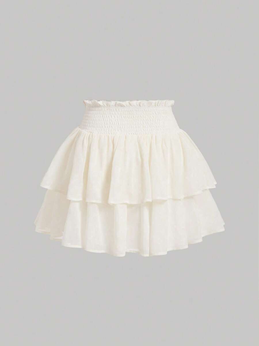 Women's high waist tiered ruffle layered mini skort in black featuring shirred details and ruffle hem.