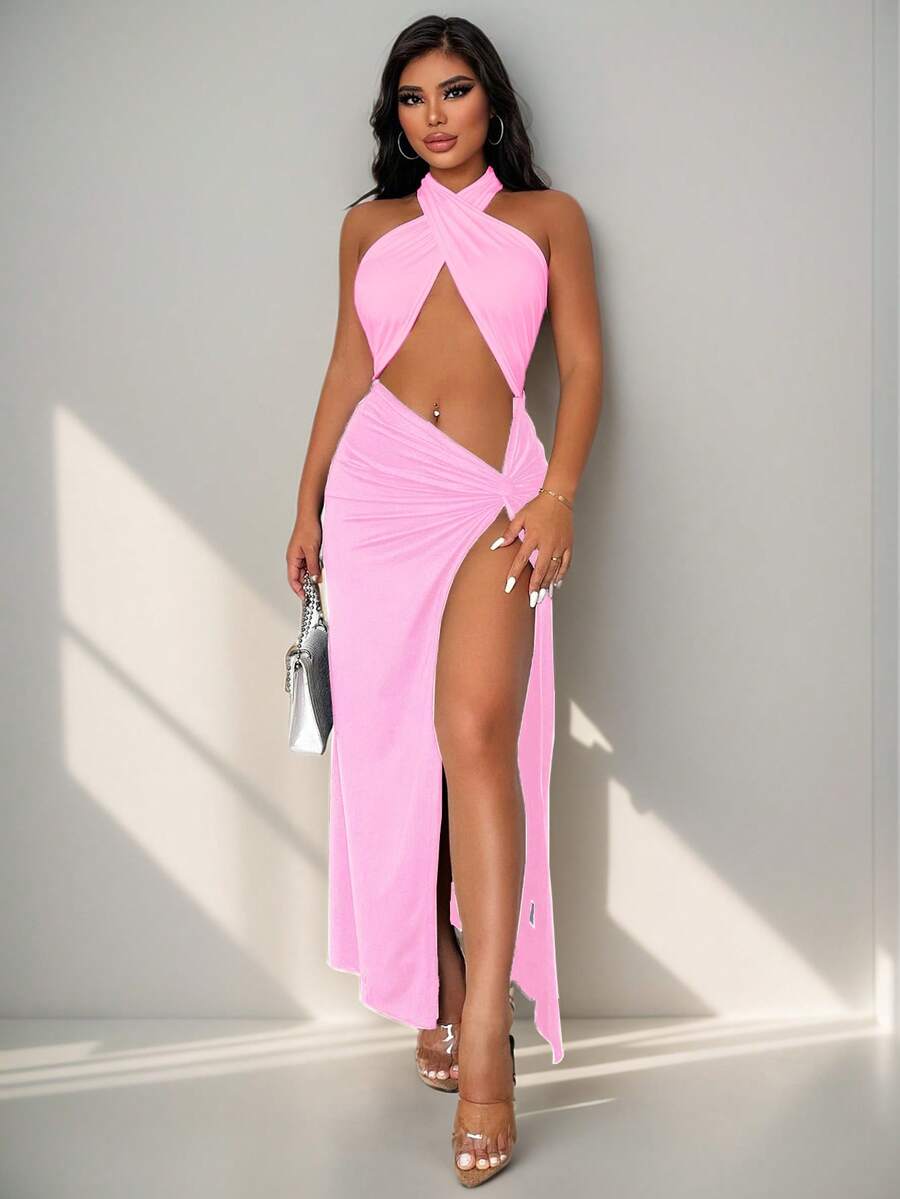 Sleeveless halter neck cut out maxi dress featuring a twist front, backless crisscross design, and split thigh slit.