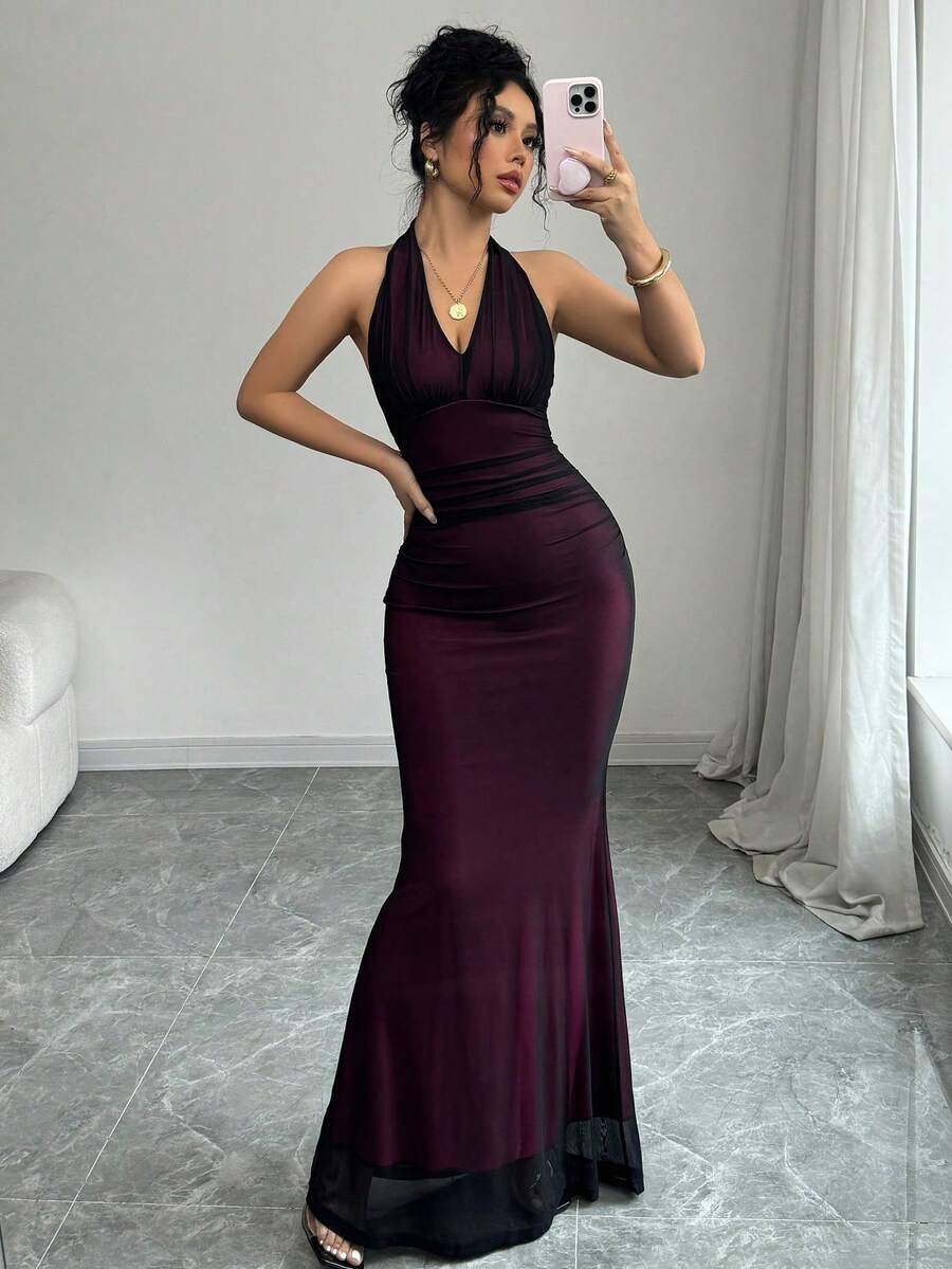 Women's long sleeve mermaid bodycon dress in high-stretch mesh fabric featuring a halter backless neckline, ruched high waist, and slim fit silhouette for formal evening wear.