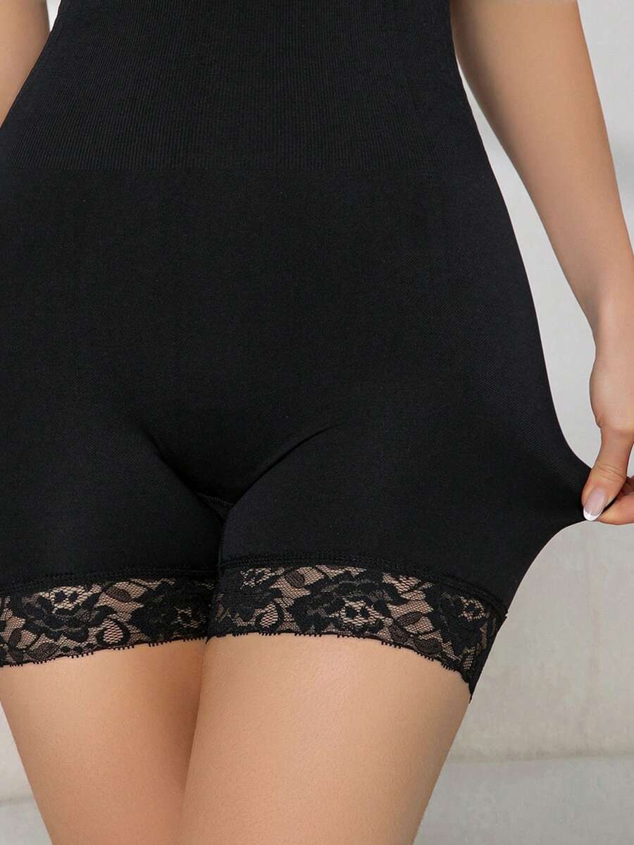 Seamless body shaper bodysuit for women featuring contrast lace details and tummy control in apricot fabric.