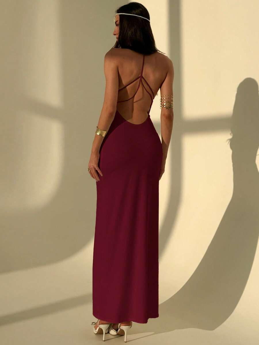 Slim fit backless halter maxi dress for women featuring criss-cross back details and spaghetti straps.