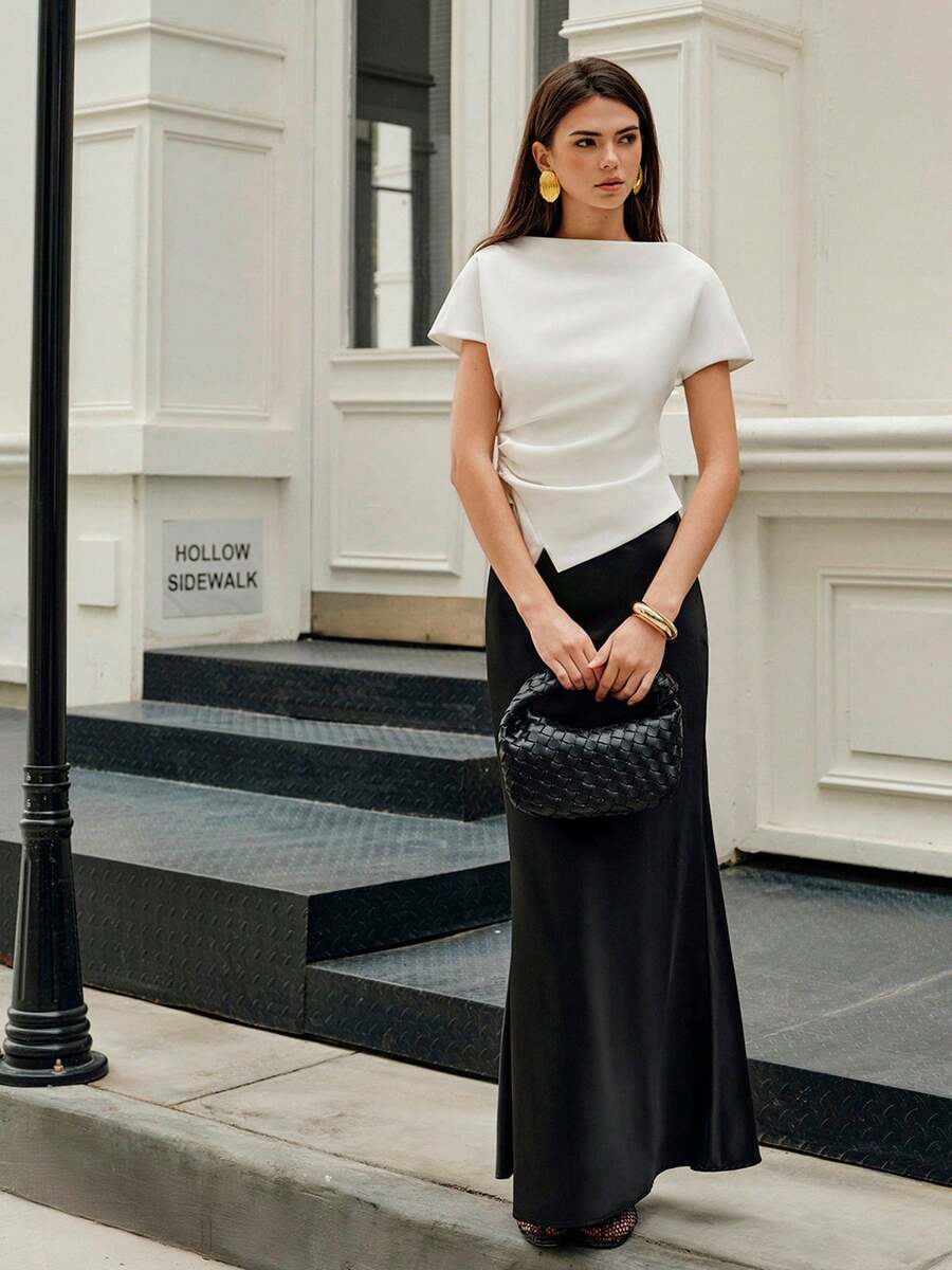 Elegant plain black mid waist long satin skirt for women featuring a sleek zipper closure and regular fit.