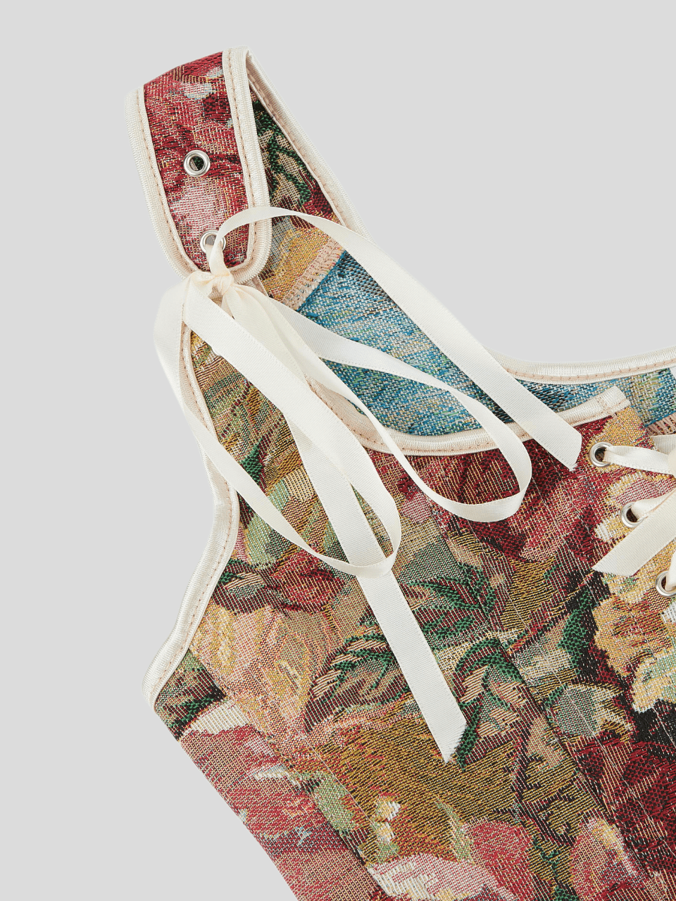 Women's retro floral print bustier top with shoulder straps, lace-up tie back, zipper, and boned construction in a romantic vintage style.