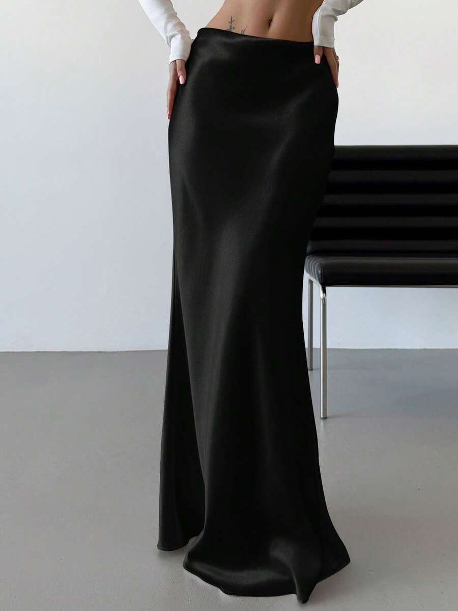 Elegant black satin high waist mermaid maxi skirt for women featuring a skinny fit and floor-length silhouette.