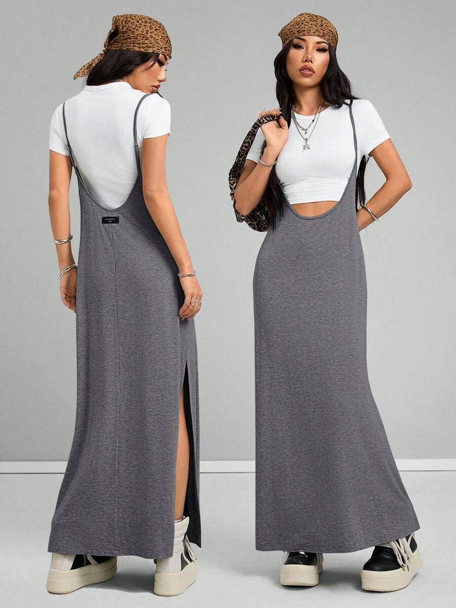 Women's black sleeveless spaghetti strap long cami dress with a side split thigh in high-stretch knitted fabric.