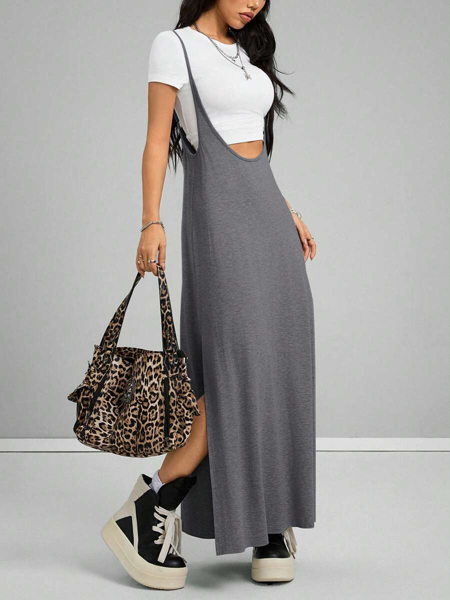 Women's black sleeveless spaghetti strap long cami dress with a side split thigh in high-stretch knitted fabric.