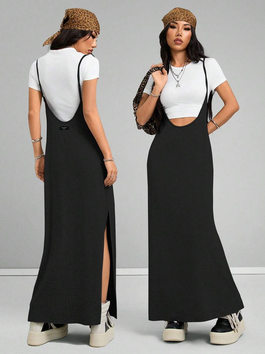 Women's black sleeveless spaghetti strap long cami dress with a side split thigh in high-stretch knitted fabric.
