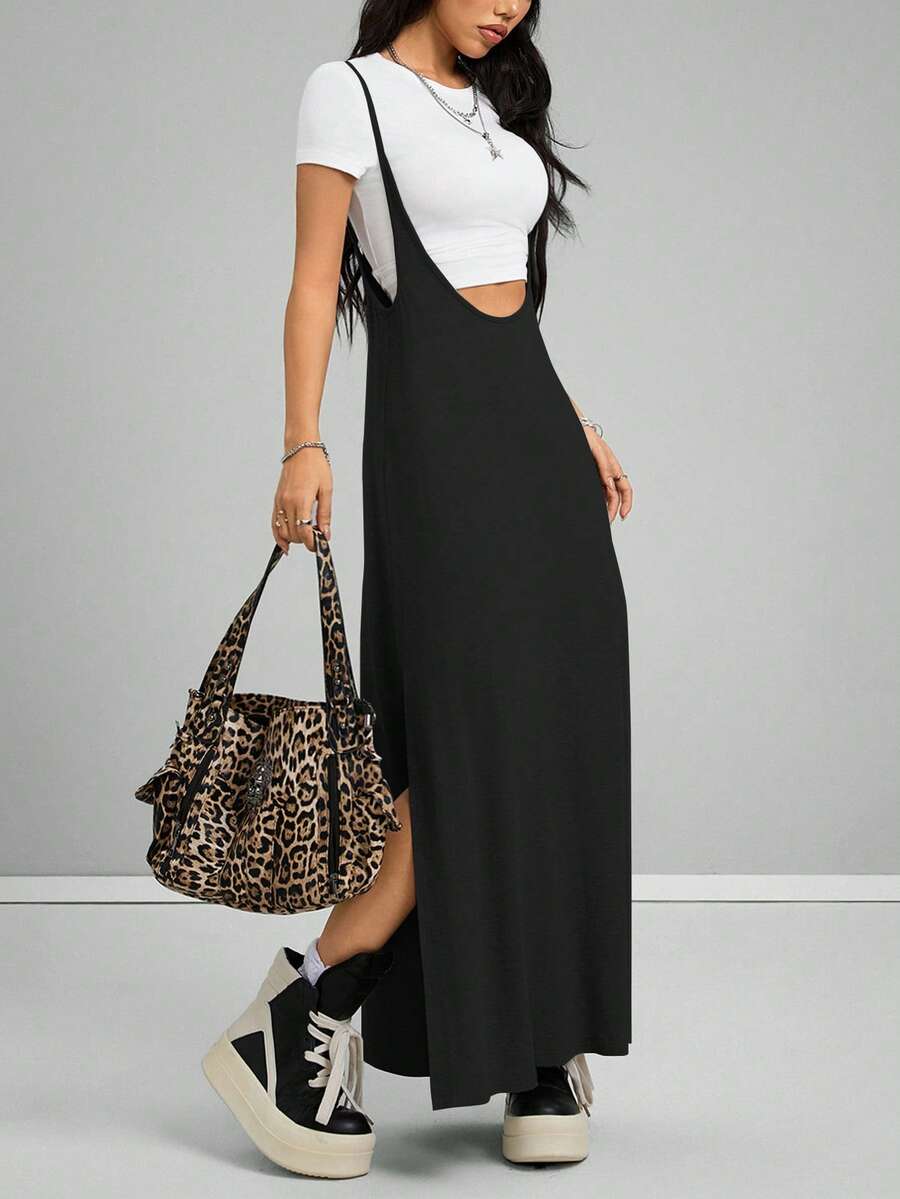Women's black sleeveless spaghetti strap long cami dress with a side split thigh in high-stretch knitted fabric.
