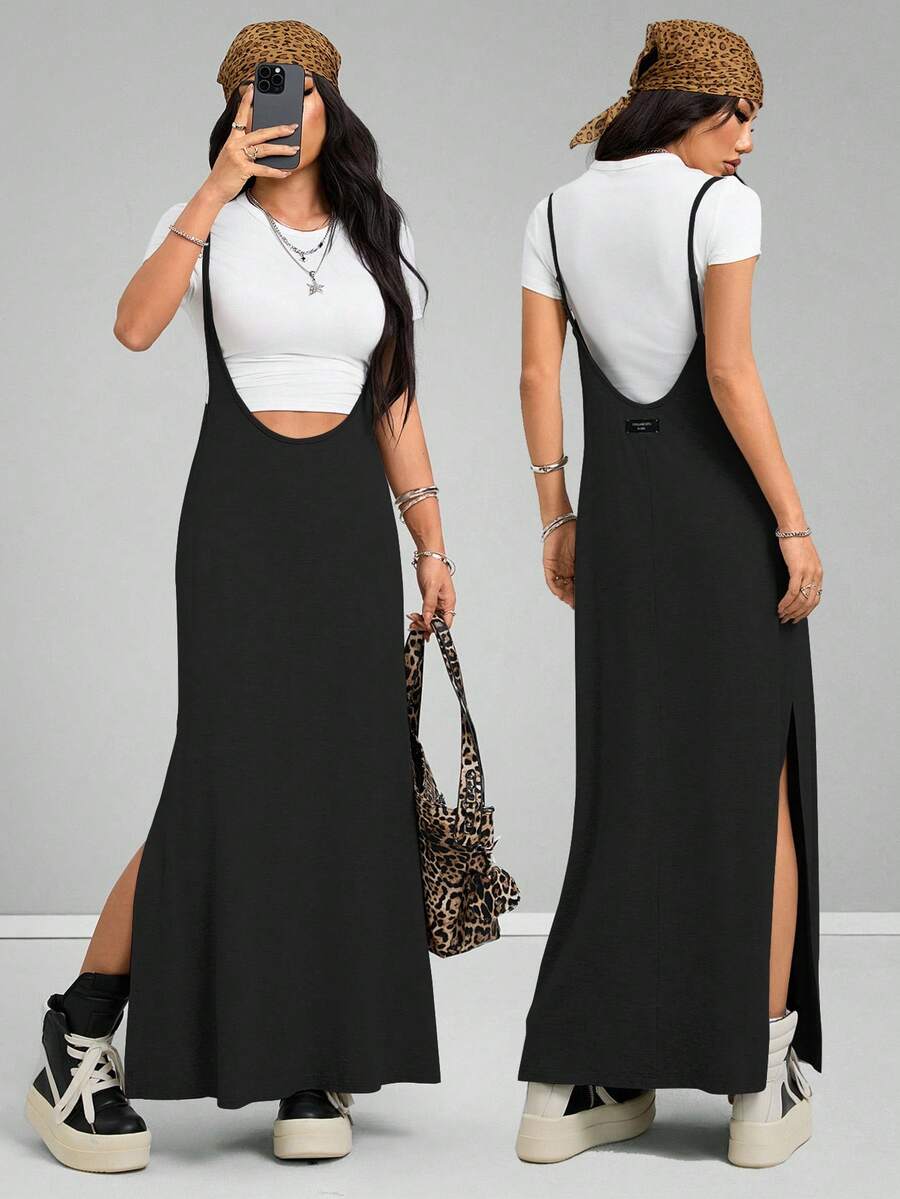 Women's black sleeveless spaghetti strap long cami dress with a side split thigh in high-stretch knitted fabric.