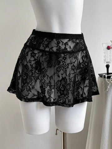Women's black semi-sheer knitted lace mini skirt featuring a flared ruffle hem and low waist design