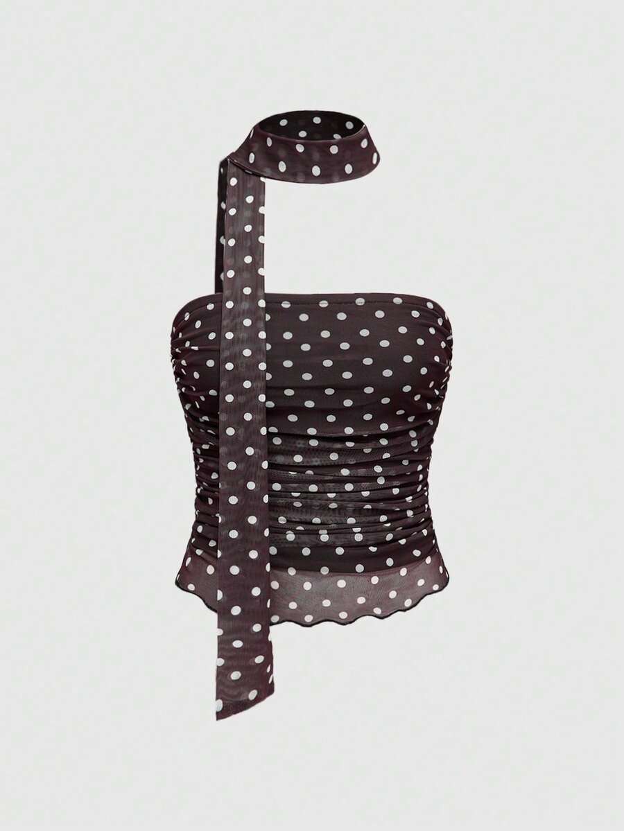Women's black polka dot strapless tube top made of ruched mesh fabric featuring an asymmetrical hem and matching scarf.
