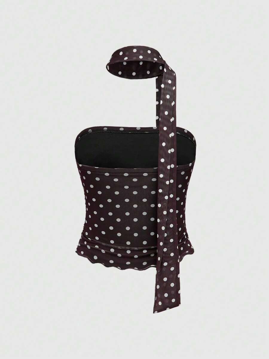 Women's black polka dot strapless tube top made of ruched mesh fabric featuring an asymmetrical hem and matching scarf.