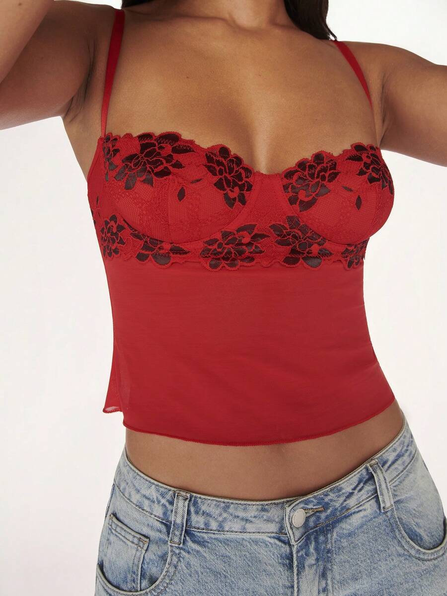 Women's black contrast lace camisole with spaghetti straps, cup detail, semi-sheer finish, and slim fit for going out or date night.