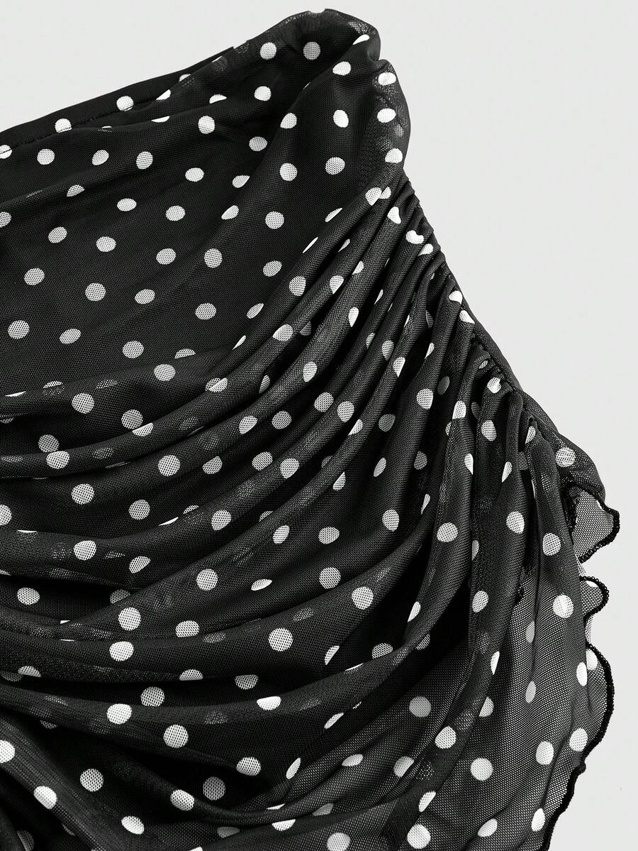 Women's black polka dot strapless tube top made of ruched mesh fabric featuring an asymmetrical hem and matching scarf.