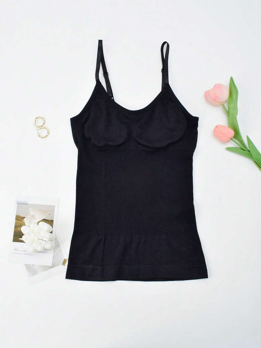 Black seamless shapewear camisole featuring targeted waist control, backless design, adjustable straps, and unlined wireless support for women.